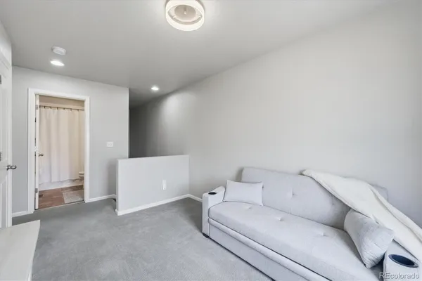 a view of livingroom with furniture and windows