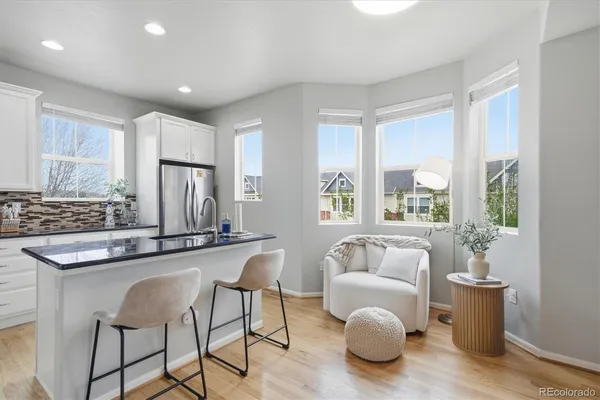 a very nice looking living room with a couch and a large window
