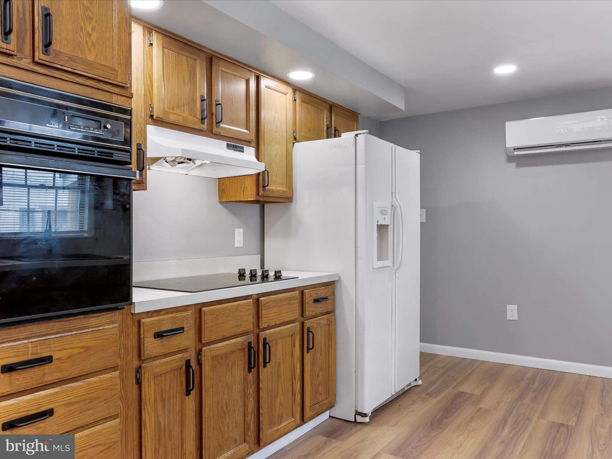 12343 Big Spring Road Clear Spring, MD 21722 - Photo 12 of 34 a kitchen with stainless steel appliances a refrigerator and a stove top oven