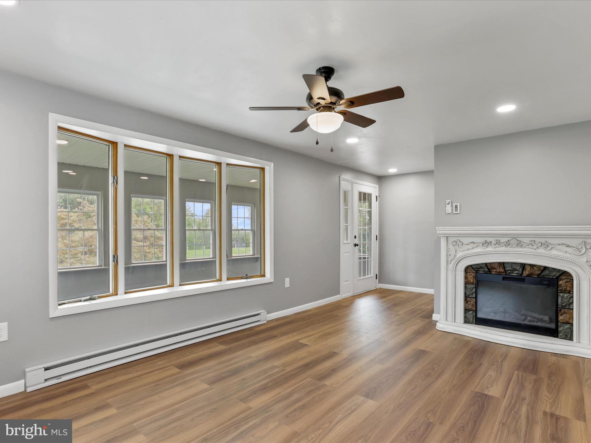 12343 Big Spring Road Clear Spring, MD 21722 - Photo 17 of 34 a view of an empty room with wooden floor and a window