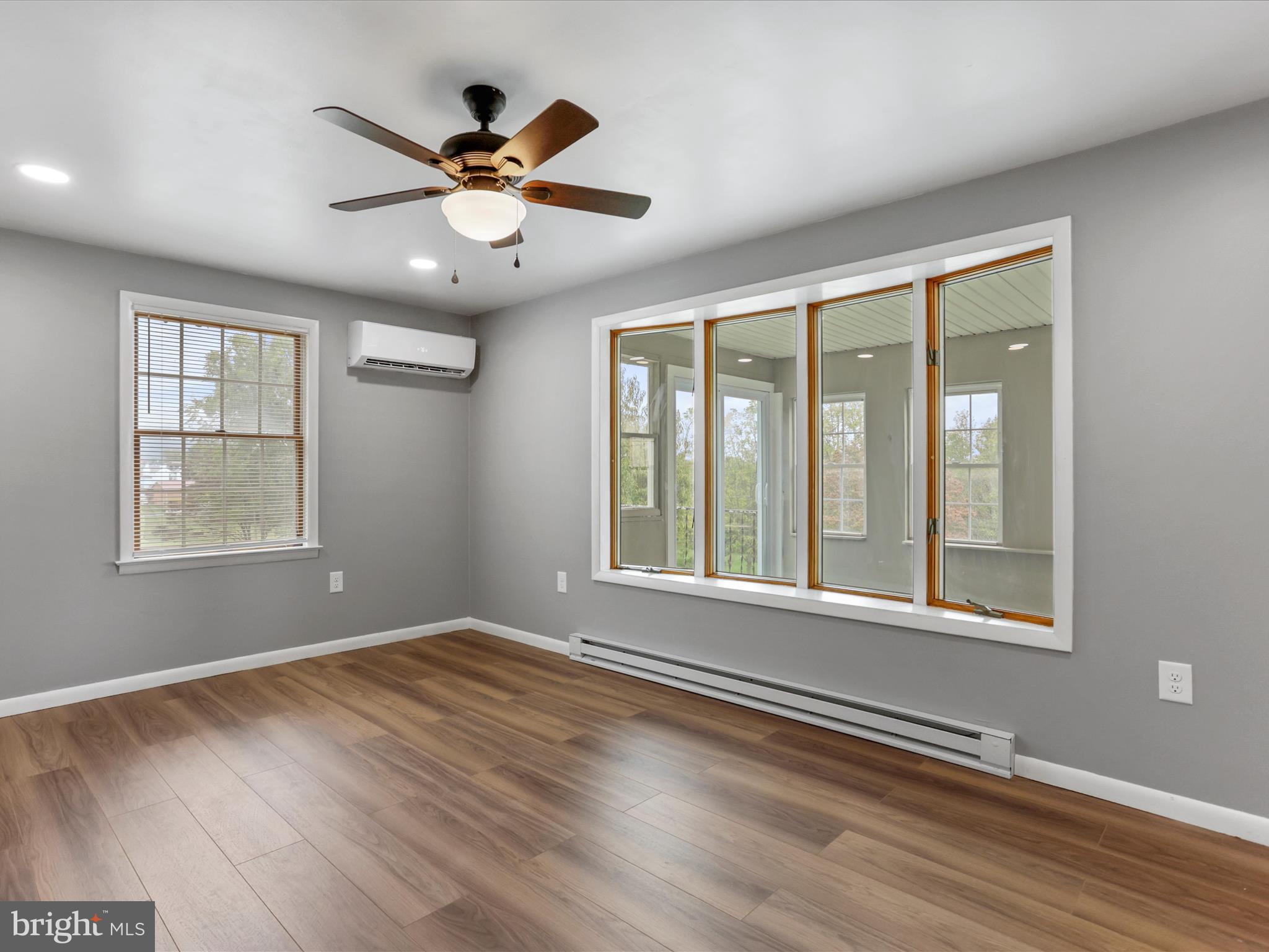 12343 Big Spring Road Clear Spring, MD 21722 - Photo 18 of 34 a view of an empty room with wooden floor and a window