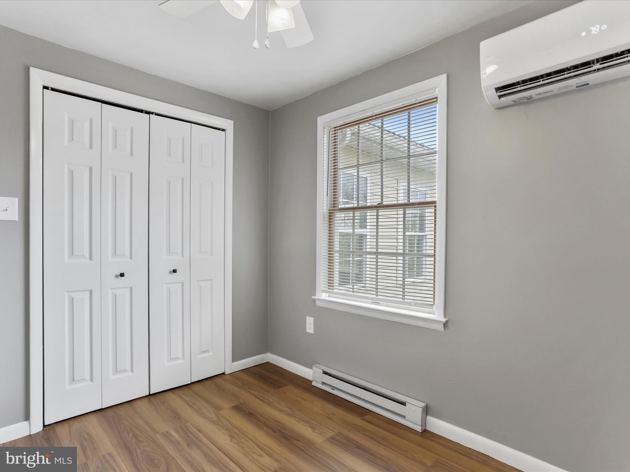 12343 Big Spring Road Clear Spring, MD 21722 - Photo 20 of 34 a view of an empty room with wooden floor and a window