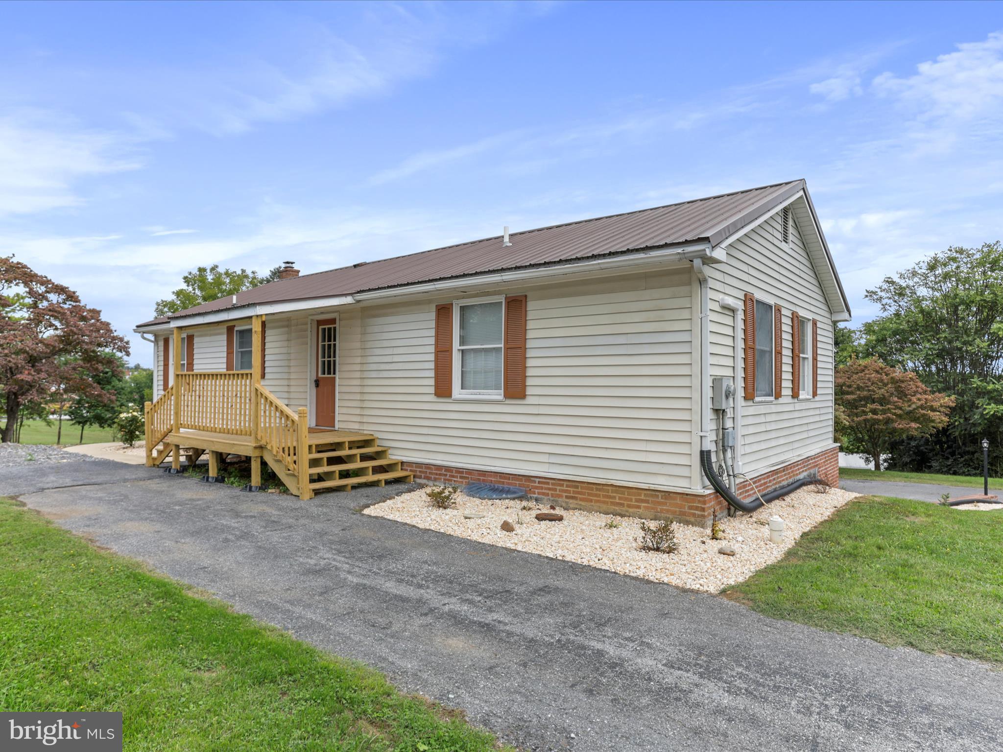 12343 Big Spring Road Clear Spring, MD 21722 - Photo 2 of 34 a backyard of a house with table and chairs