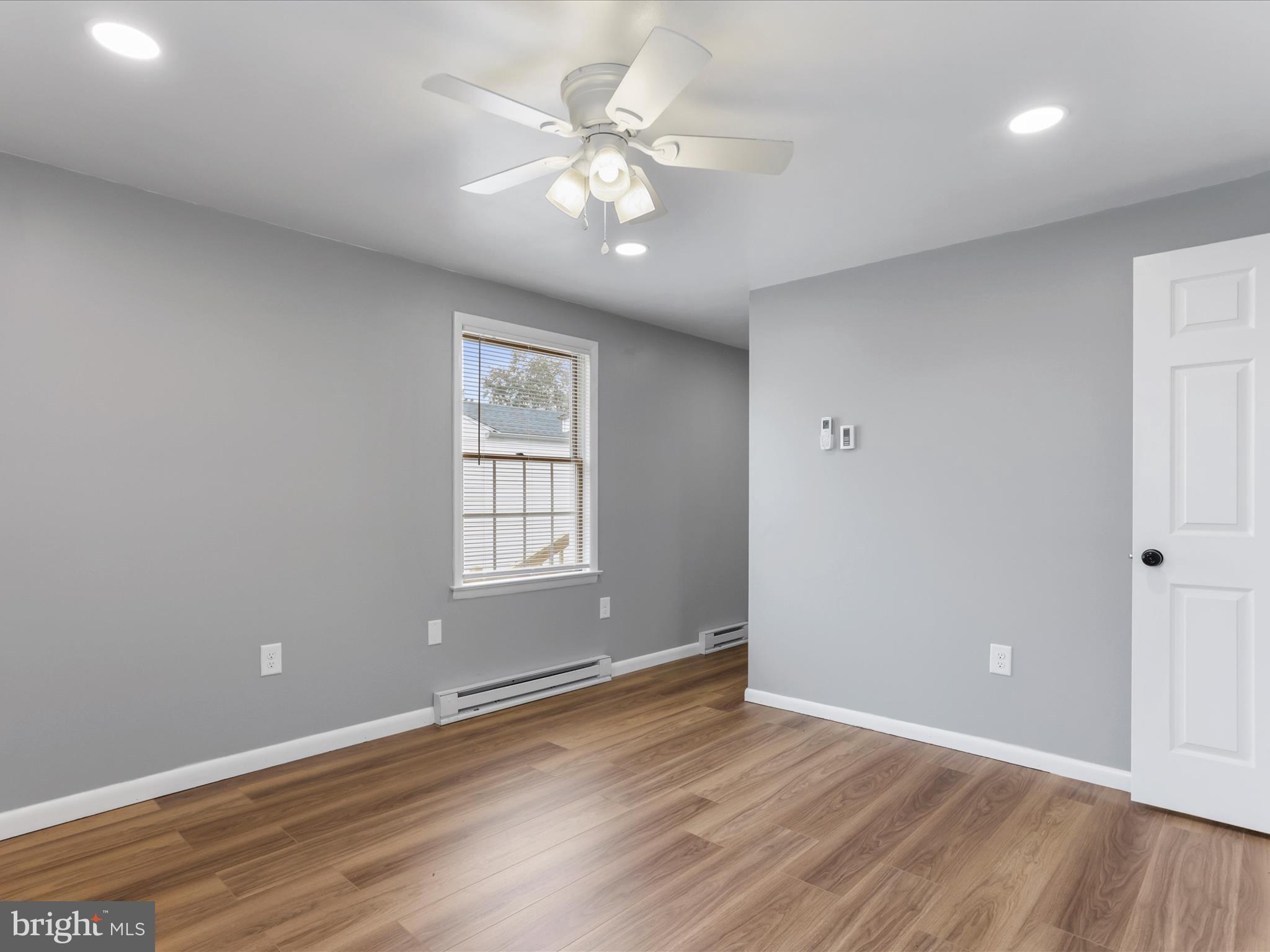 12343 Big Spring Road Clear Spring, MD 21722 - Photo 26 of 34 an empty room with wooden floor and windows