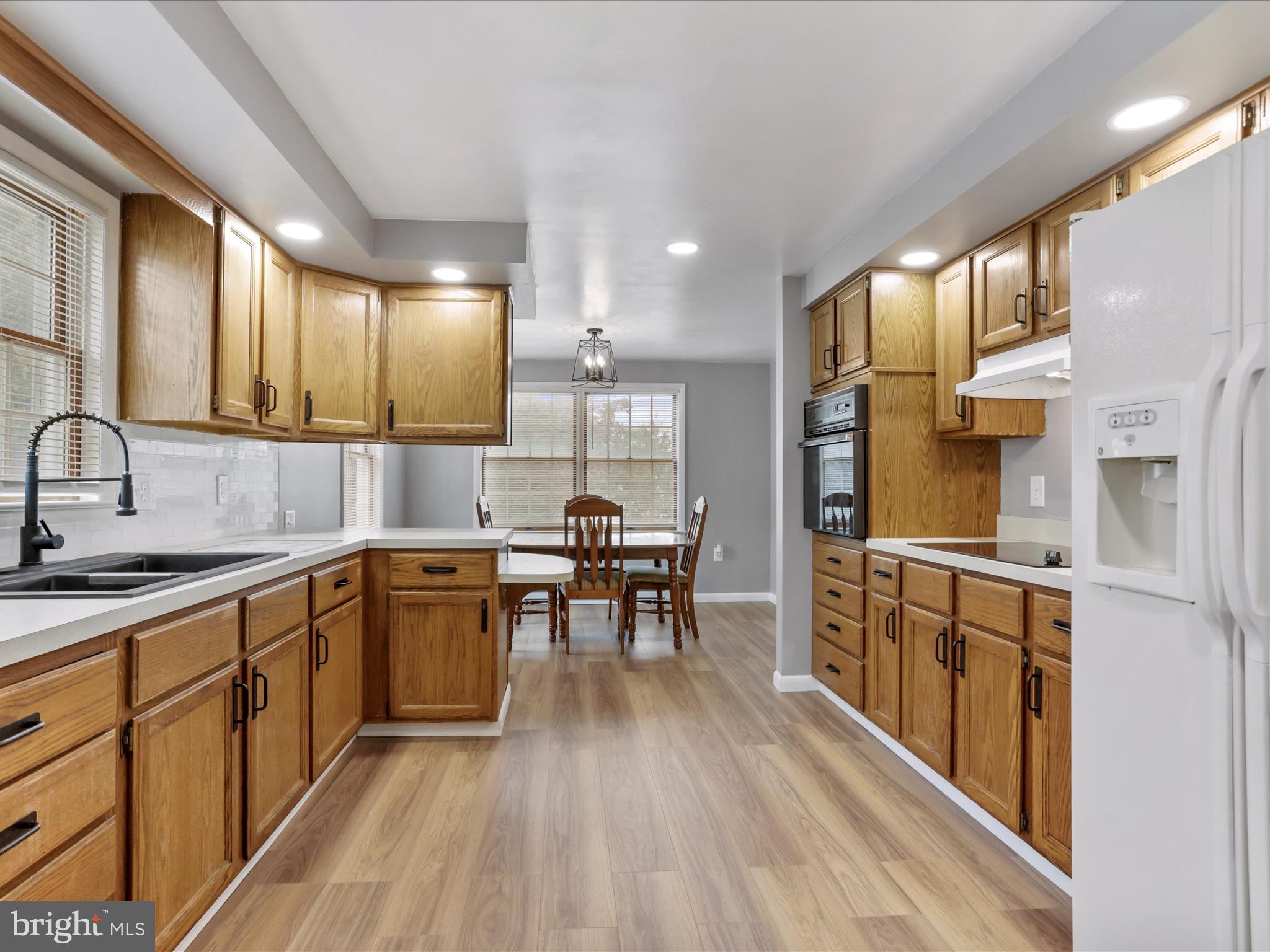 12343 Big Spring Road Clear Spring, MD 21722 - Photo 9 of 34 a kitchen with stainless steel appliances granite countertop sink stove top oven and cabinets