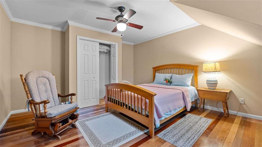 733 Unity Church Road Summerville, GA 30747 - Photo 23 of 75 a bedroom with a bed a table and chair