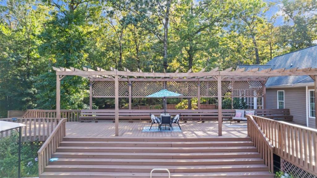 733 Unity Church Road Summerville, GA 30747 - Photo 28 of 75 a view of a patio with a table and chairs