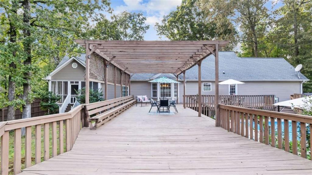 733 Unity Church Road Summerville, GA 30747 - Photo 29 of 75 a view of house with deck outdoor seating and yard