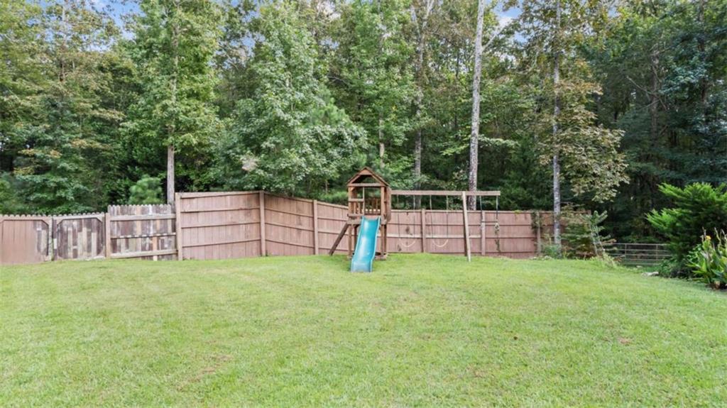733 Unity Church Road Summerville, GA 30747 - Photo 34 of 75 a view of a backyard with white fence