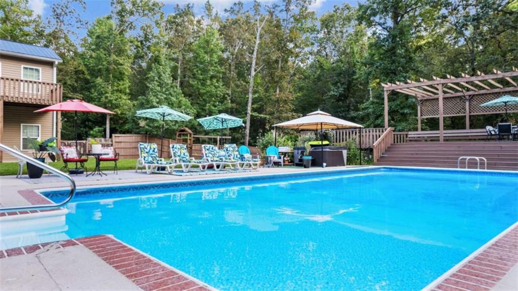 733 Unity Church Road Summerville, GA 30747 - Photo 40 of 75 a front view of a house with swimming pool and patio