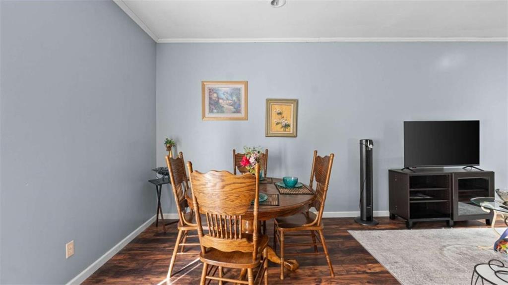 733 Unity Church Road Summerville, GA 30747 - Photo 48 of 75 a dining room with furniture and a flat screen tv