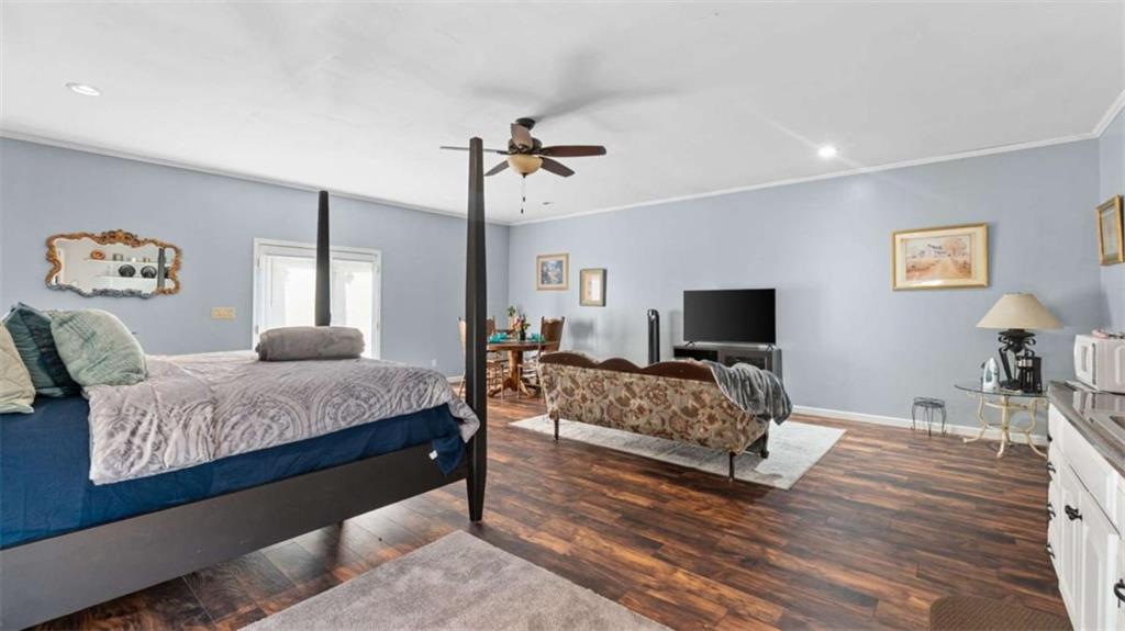 733 Unity Church Road Summerville, GA 30747 - Photo 50 of 75 a bedroom with a bed and a flat screen tv