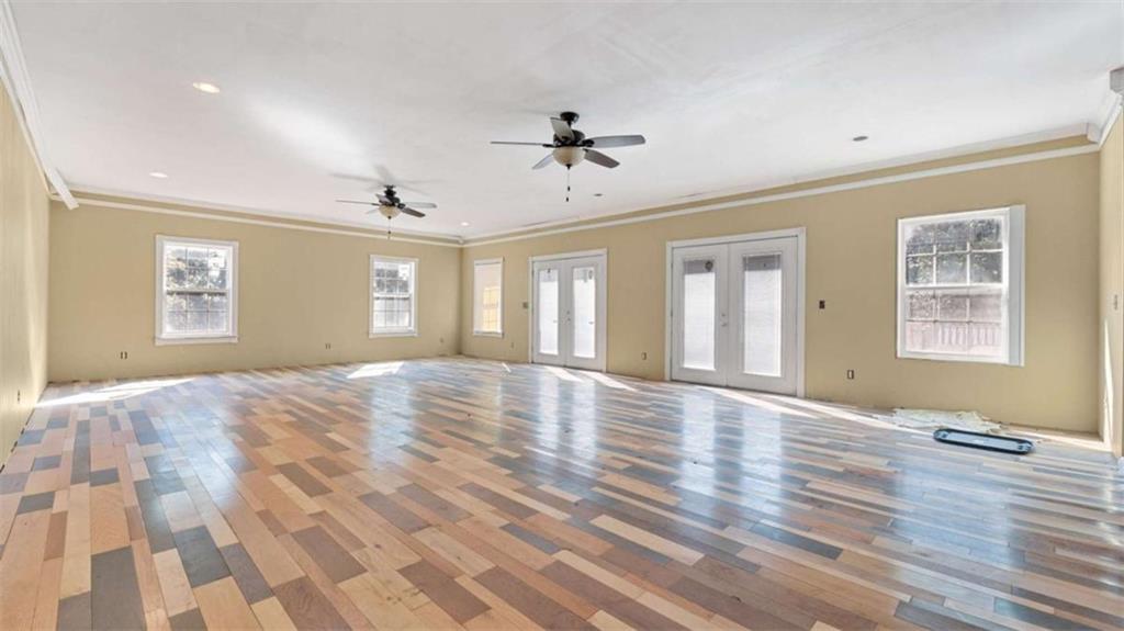 733 Unity Church Road Summerville, GA 30747 - Photo 59 of 75 a view of empty room with wooden floor and fan