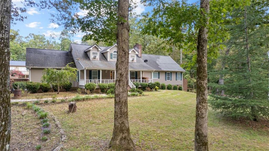 733 Unity Church Road Summerville, GA 30747 - Photo 70 of 75 a front view of a house with a yard and garage