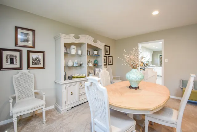 a dining room with furniture and window