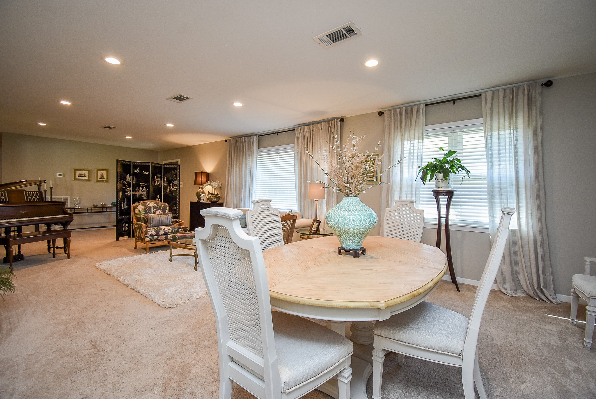 2146 17th Street Hempstead, TX 77445 - Photo 13 of 50 a view of a dining room with furniture and a potted plant