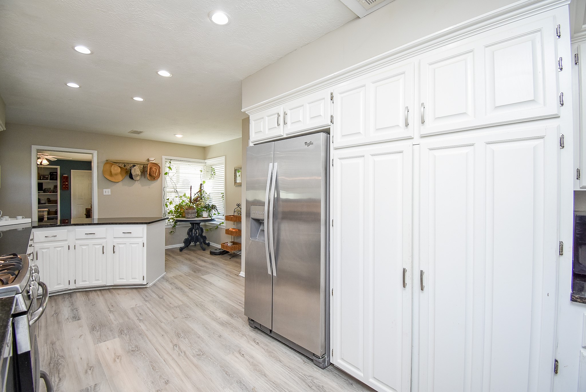 2146 17th Street Hempstead, TX 77445 - Photo 15 of 50 a kitchen with stainless steel appliances refrigerator cabinets and wooden floor