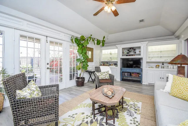 a living room with furniture fireplace and a flat screen tv