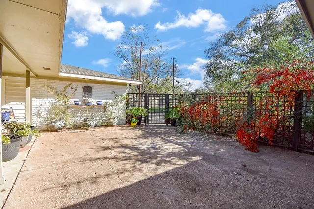 a view of a house with backyard porch and sitting area