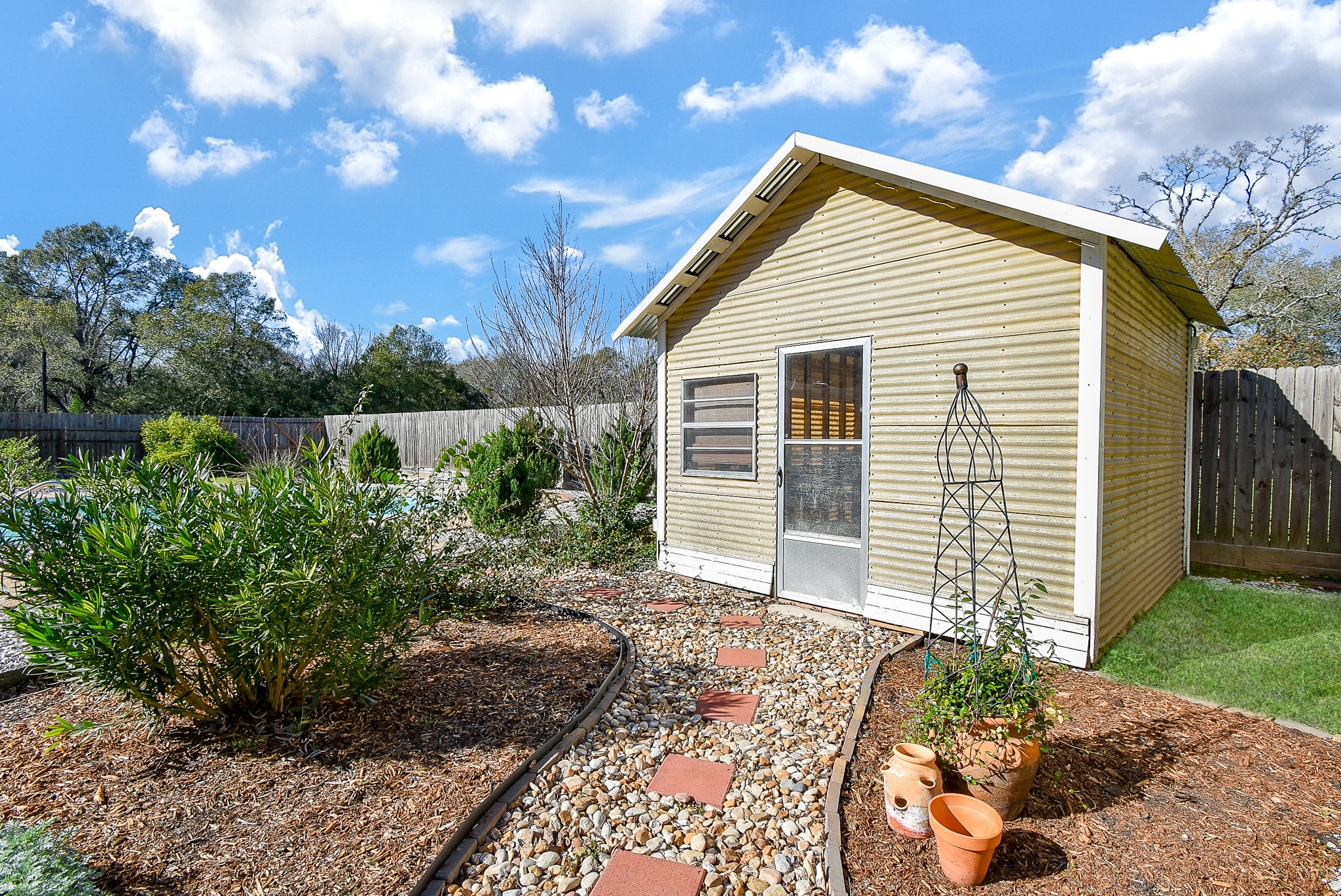 2146 17th Street Hempstead, TX 77445 - Photo 47 of 50 a front view of a house with garden