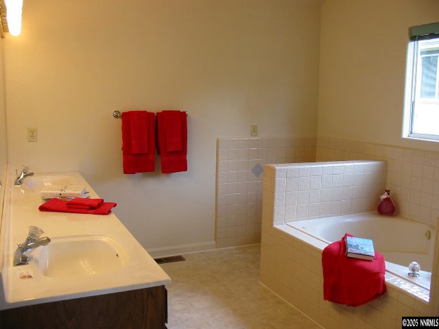 1630 Peavine Road Reno, NV 89503 - Photo 8 of 9 a bathroom with a sink and a mirror