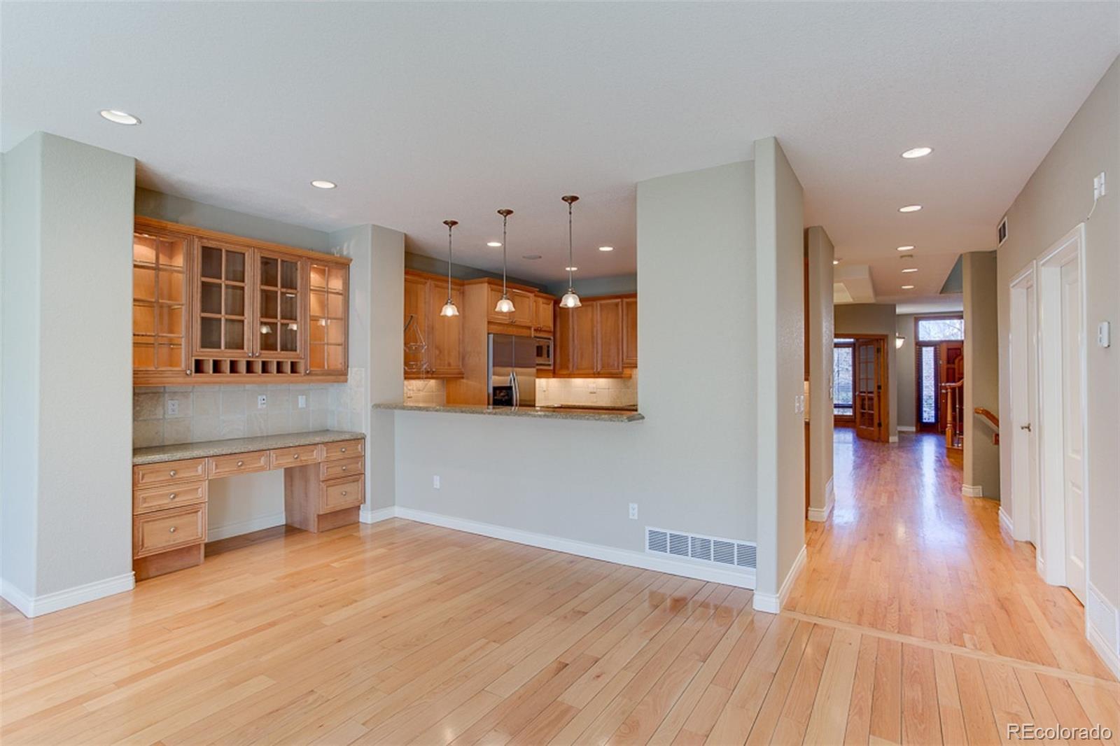 338 St Paul Street Denver, CO 80206 - Photo 11 of 35 a open kitchen with stainless steel appliances granite countertop a refrigerator and a sink