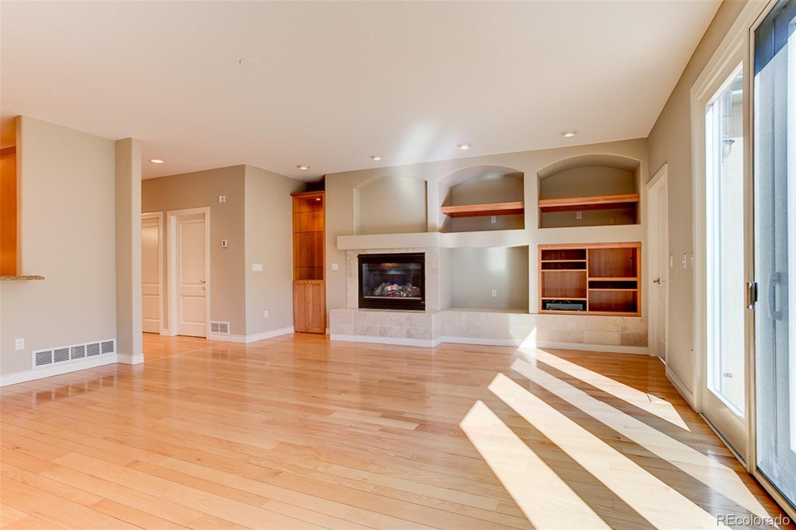 338 St Paul Street Denver, CO 80206 - Photo 12 of 35 a view of living room with furniture and a flat screen tv
