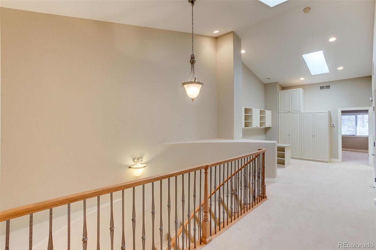 338 St Paul Street Denver, CO 80206 - Photo 15 of 35 a view of a hallway with wooden floor