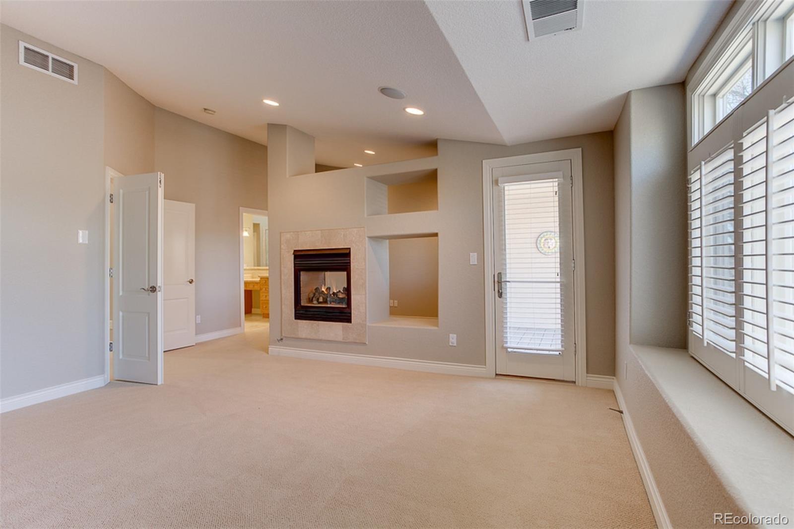 338 St Paul Street Denver, CO 80206 - Photo 17 of 35 an empty room with windows and fireplace