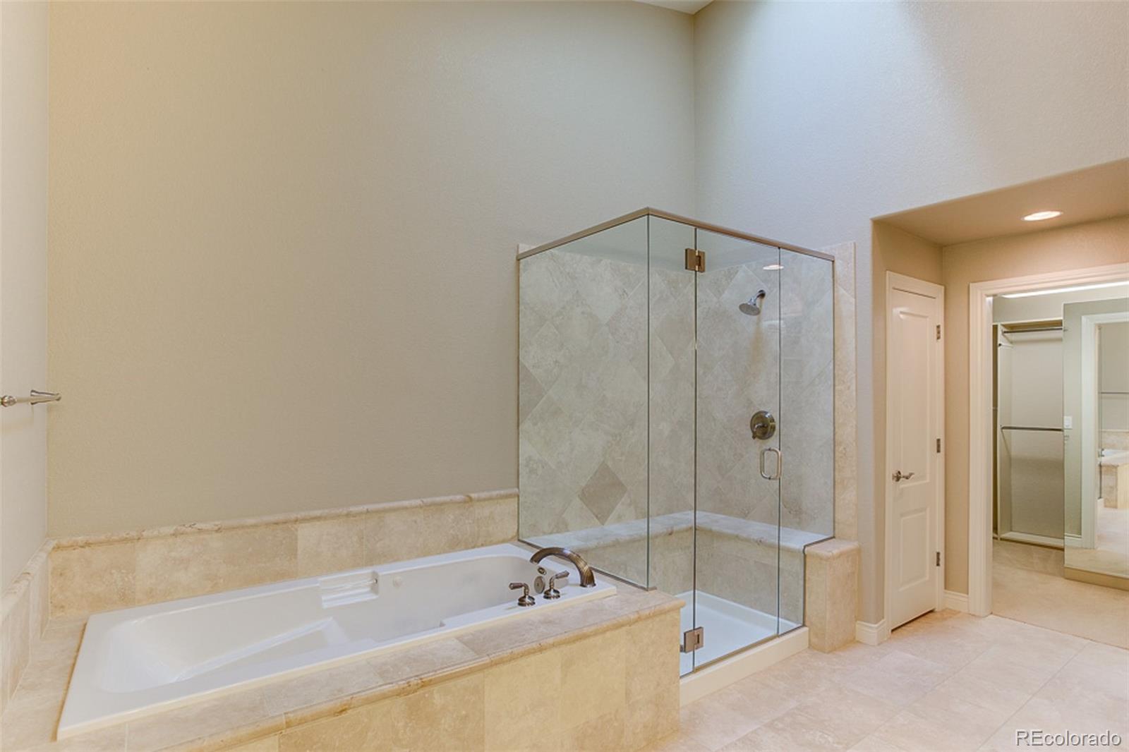 338 St Paul Street Denver, CO 80206 - Photo 20 of 35 a bathroom with a tub and sink