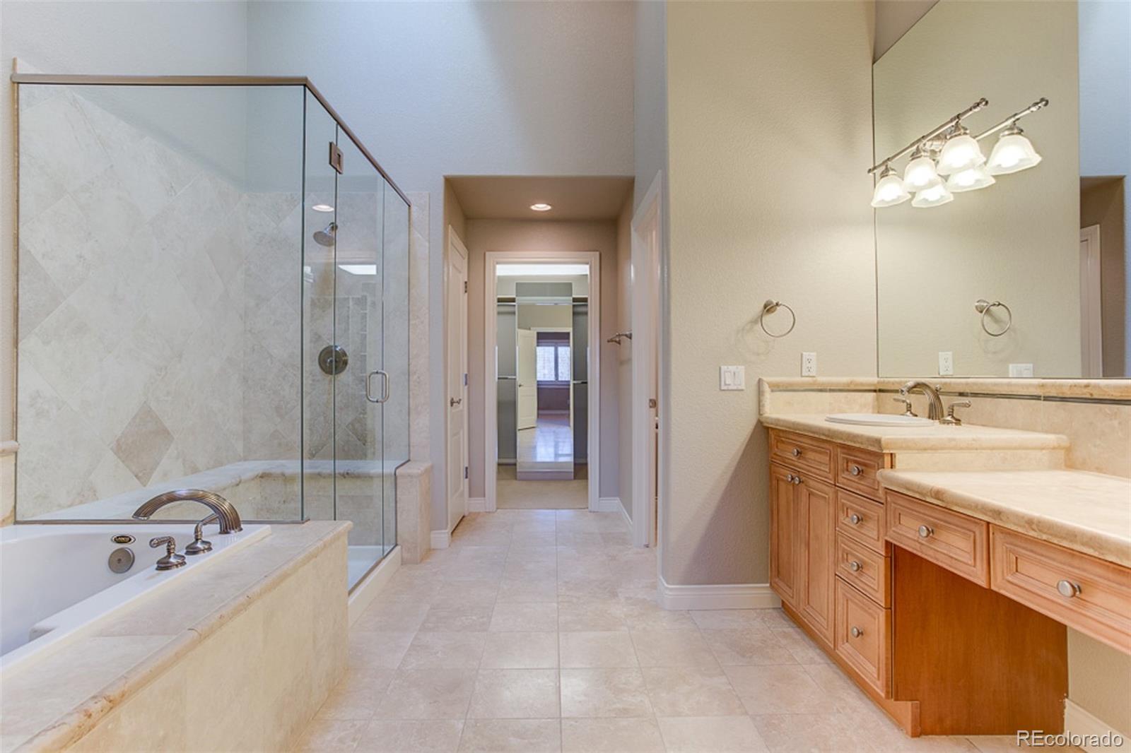 338 St Paul Street Denver, CO 80206 - Photo 21 of 35 a spacious bathroom with a double vanity sink mirror and double