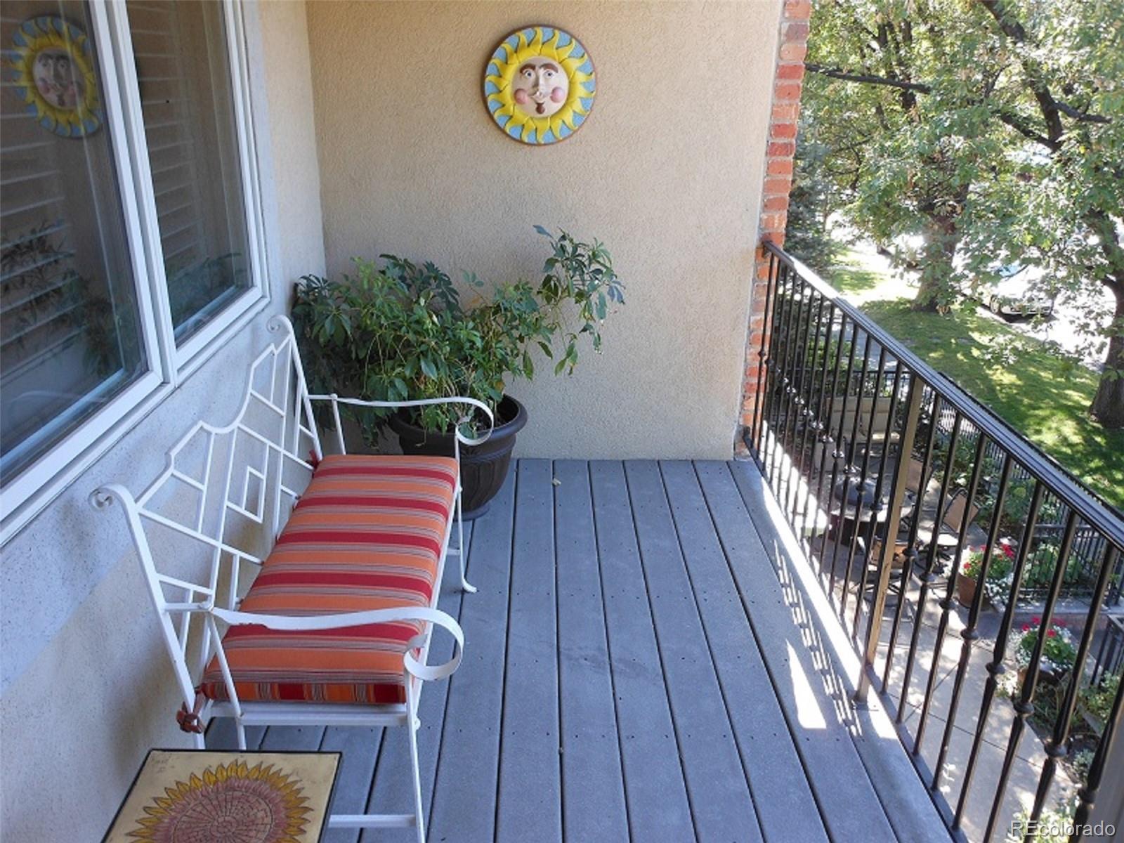 338 St Paul Street Denver, CO 80206 - Photo 23 of 35 a balcony with stairs and wooden floor