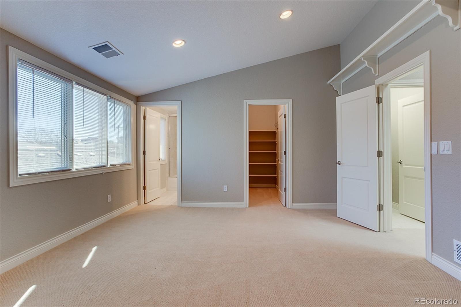 338 St Paul Street Denver, CO 80206 - Photo 24 of 35 an empty room with windows and closet