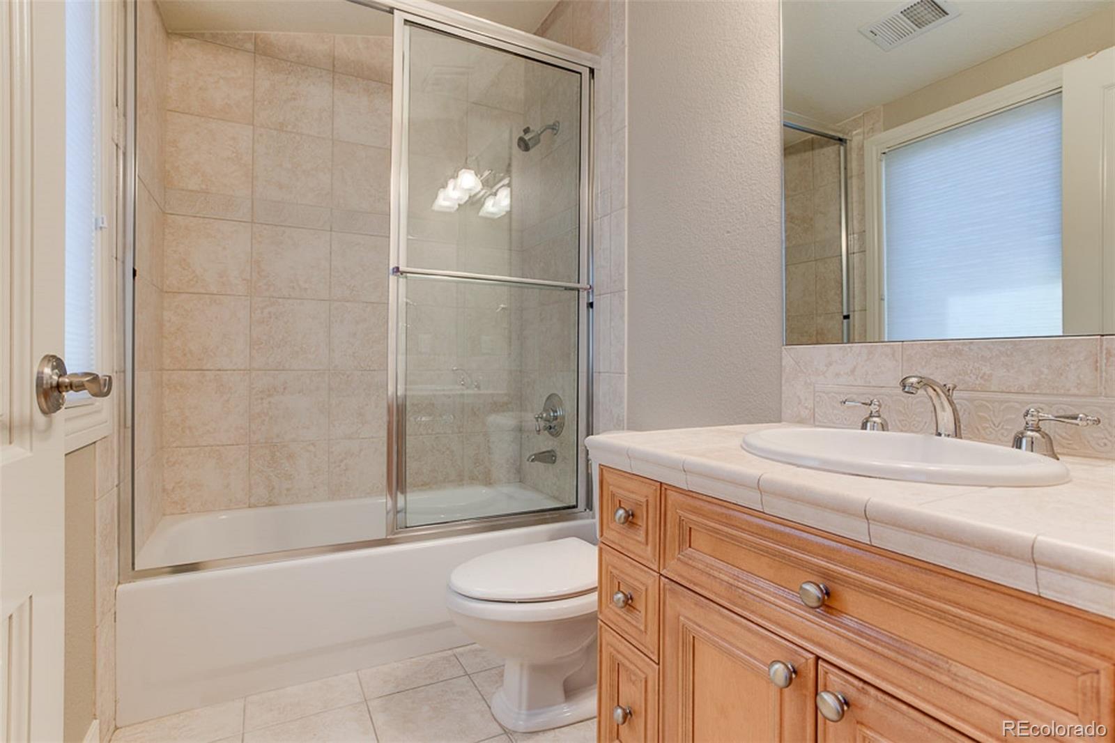 338 St Paul Street Denver, CO 80206 - Photo 25 of 35 a bathroom with a sink a toilet and shower