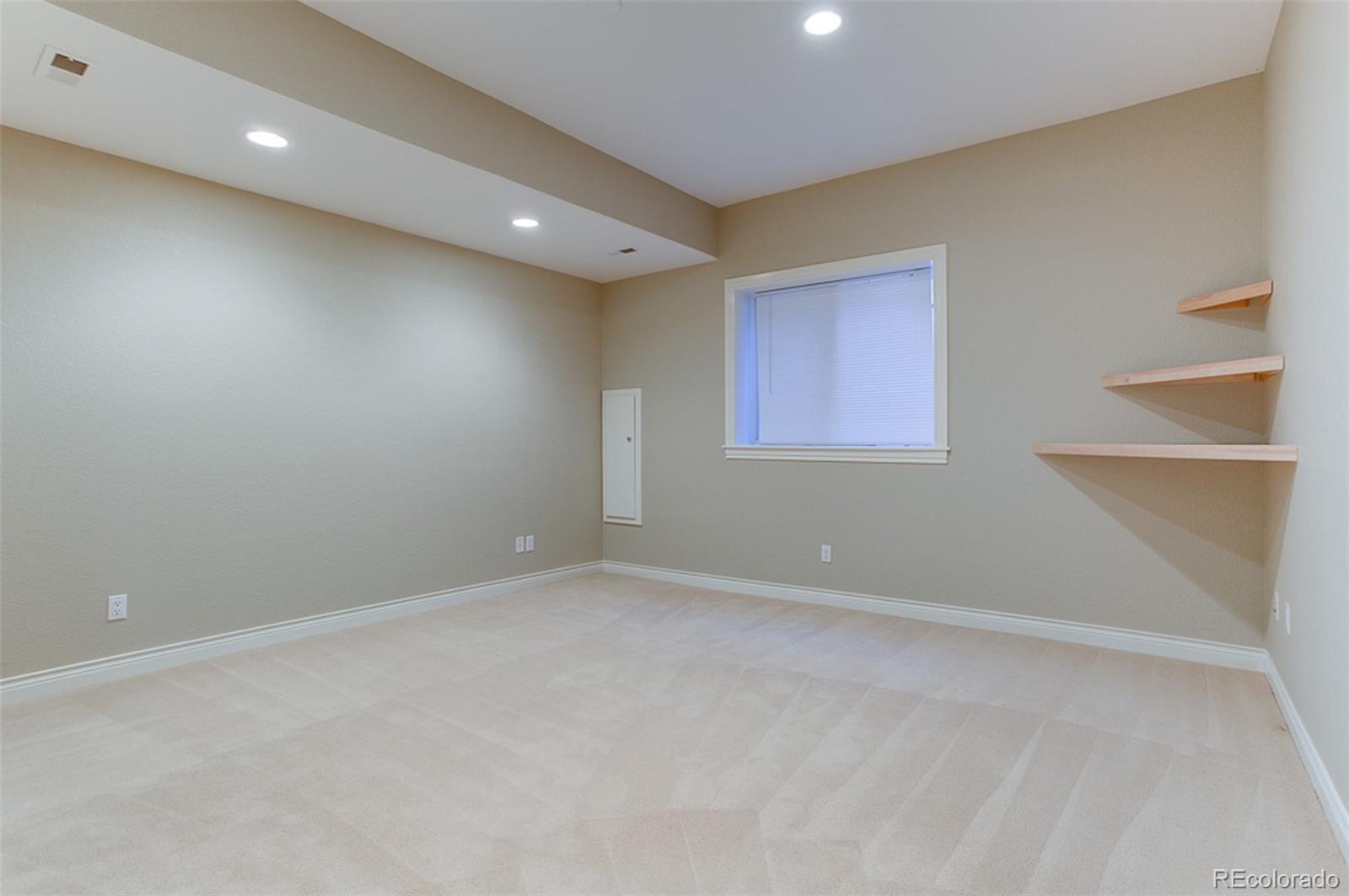 338 St Paul Street Denver, CO 80206 - Photo 28 of 35 an empty room with a windows and closet