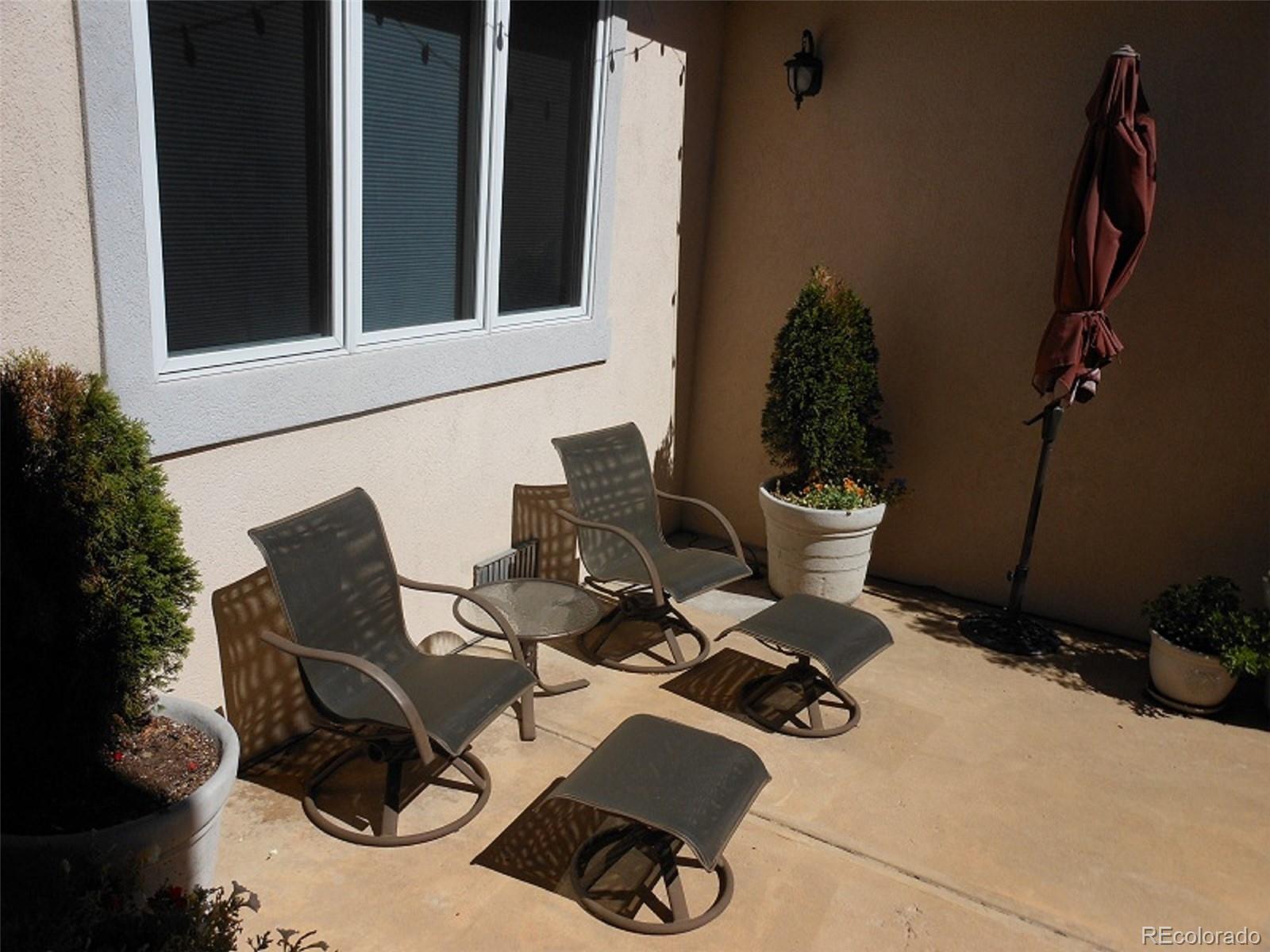 338 St Paul Street Denver, CO 80206 - Photo 33 of 35 a view of a chairs and table in patio