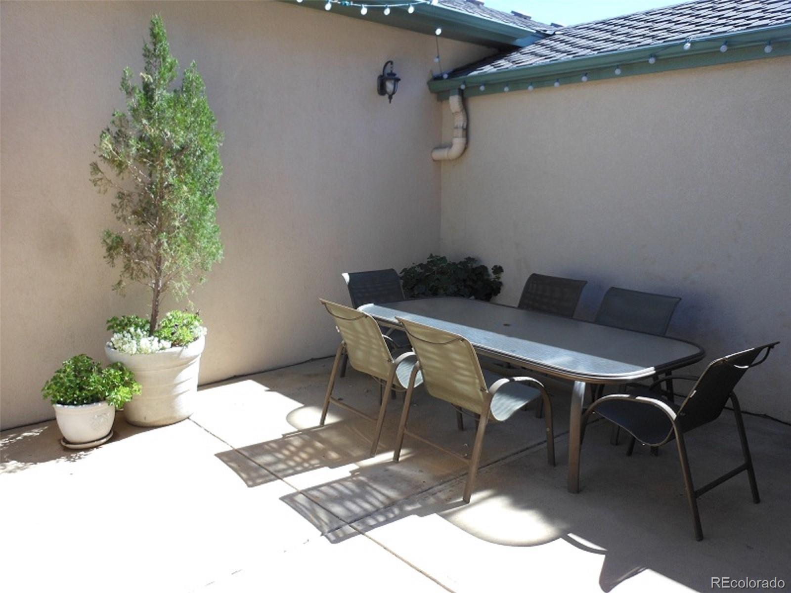 338 St Paul Street Denver, CO 80206 - Photo 34 of 35 a table and chairs in a room