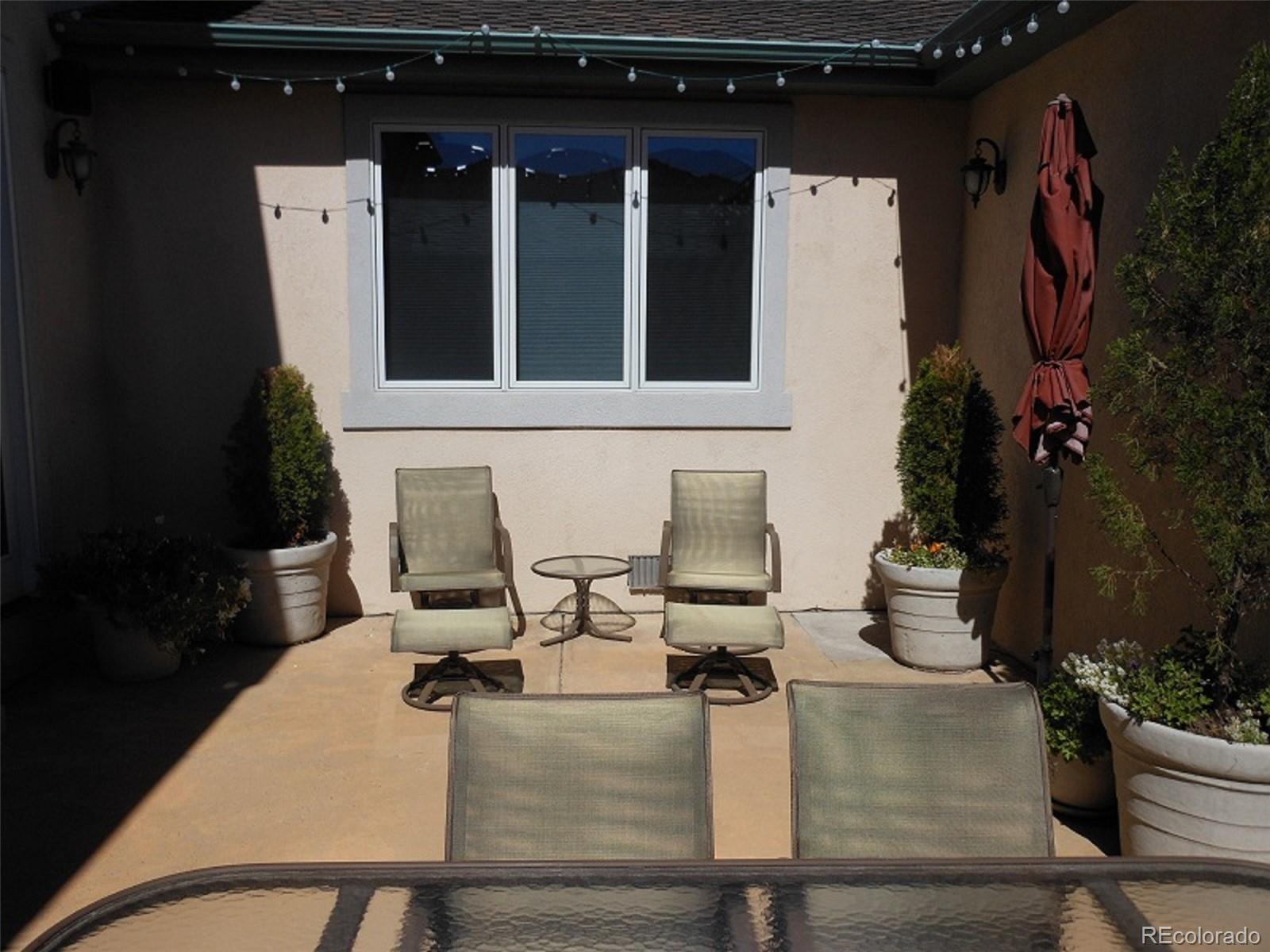 338 St Paul Street Denver, CO 80206 - Photo 35 of 35 a view of a chairs and table in a patio