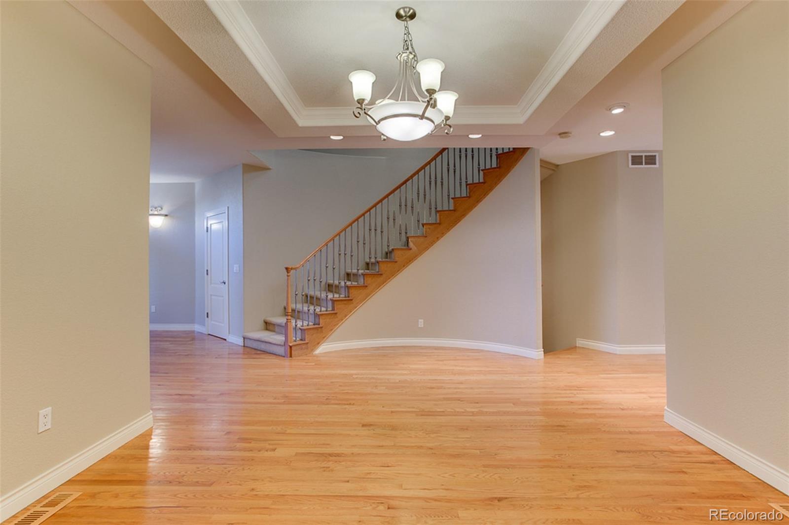338 St Paul Street Denver, CO 80206 - Photo 6 of 35 a view of entryway and hall with wooden floor