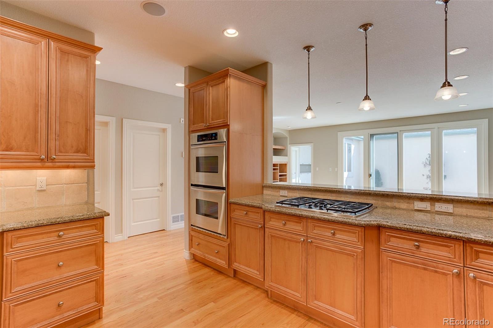 338 St Paul Street Denver, CO 80206 - Photo 9 of 35 a kitchen with stainless steel appliances granite countertop a refrigerator and a stove top oven