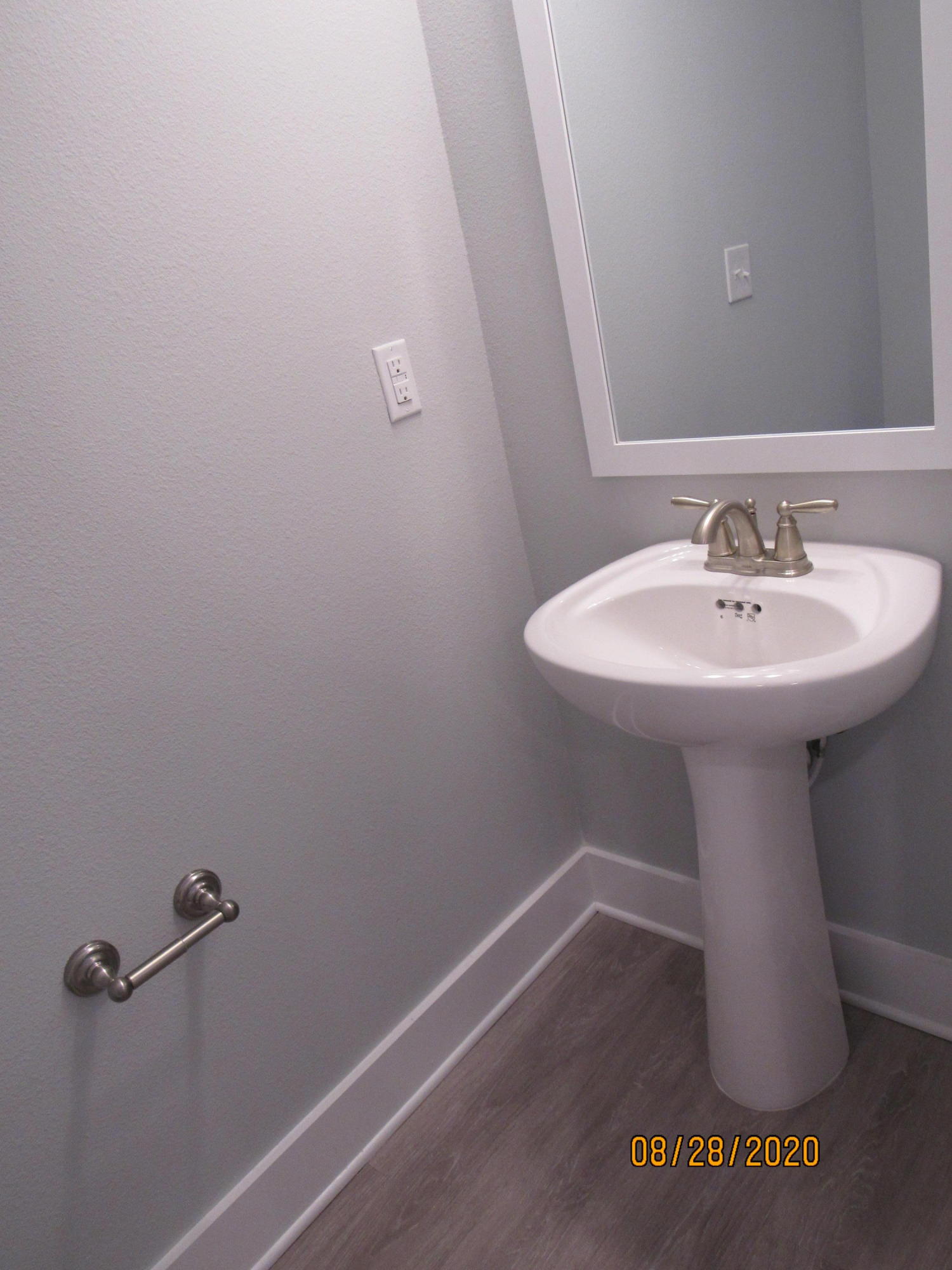 69 South Sand Palm Road Freeport, FL 32439 - Photo 4 of 13 a bathroom with a sink and a mirror