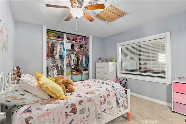 a bedroom with a bed and furniture