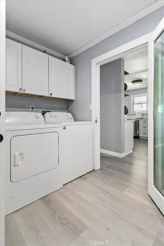 a bedroom with furniture and a flat screen tv