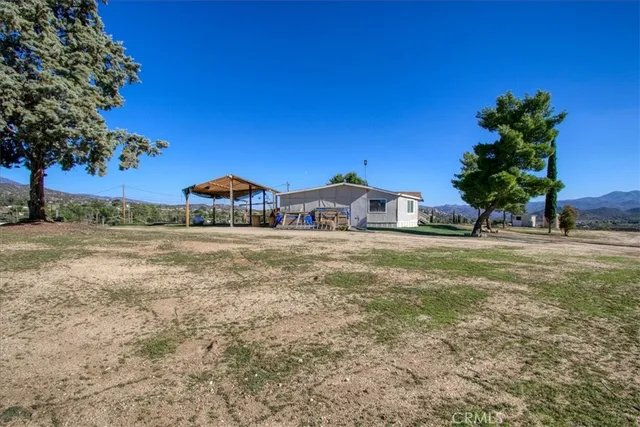 a view of a backyard of a house