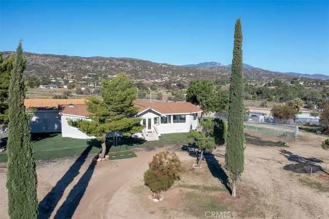 an aerial view of residential houses with outdoor space