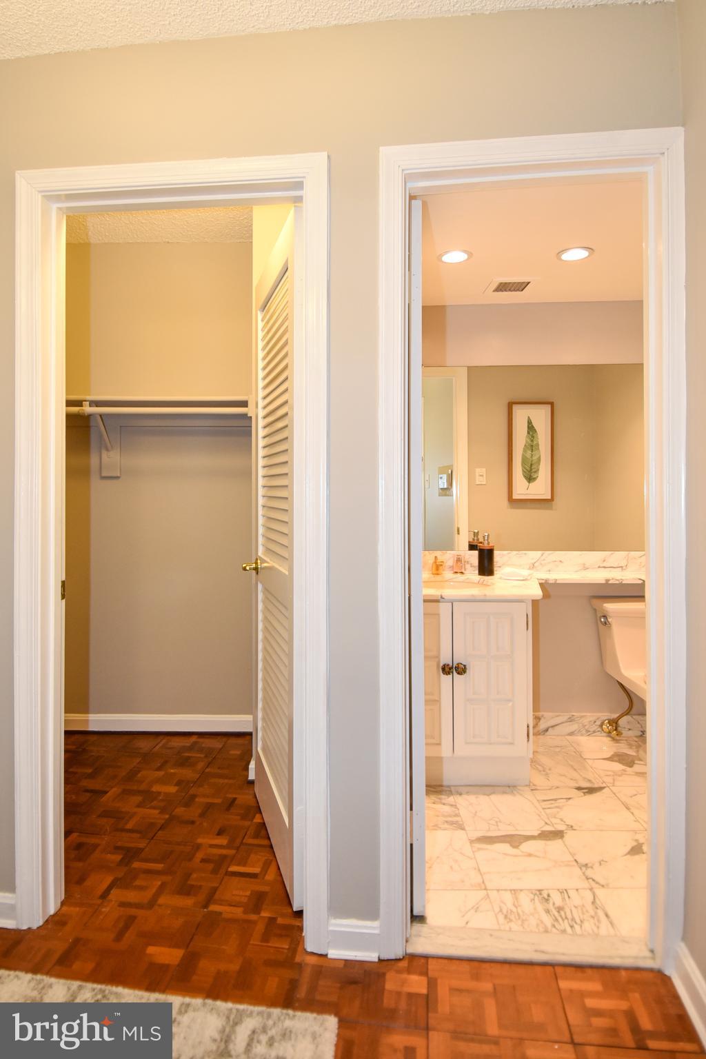 1101 South Arlington Ridge Road, Unit 305 Arlington, VA 22202 - Photo 7 of 57 Foyer Walk-in Closet and Powder Room