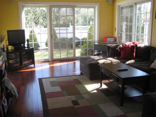3 Parkerville Road Chelmsford, MA 01824 - Photo 4 of 27 a living room with furniture and a flat screen tv
