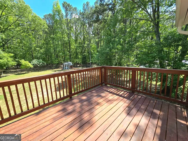 a view of balcony with wooden floor