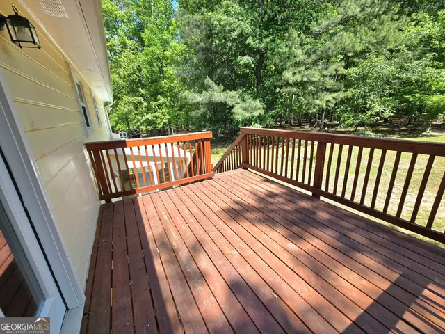 a view of balcony with wooden floor