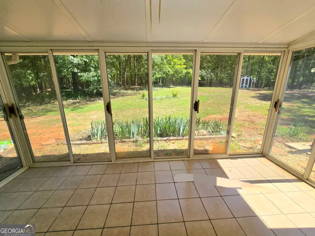 a view of an empty room with a large window